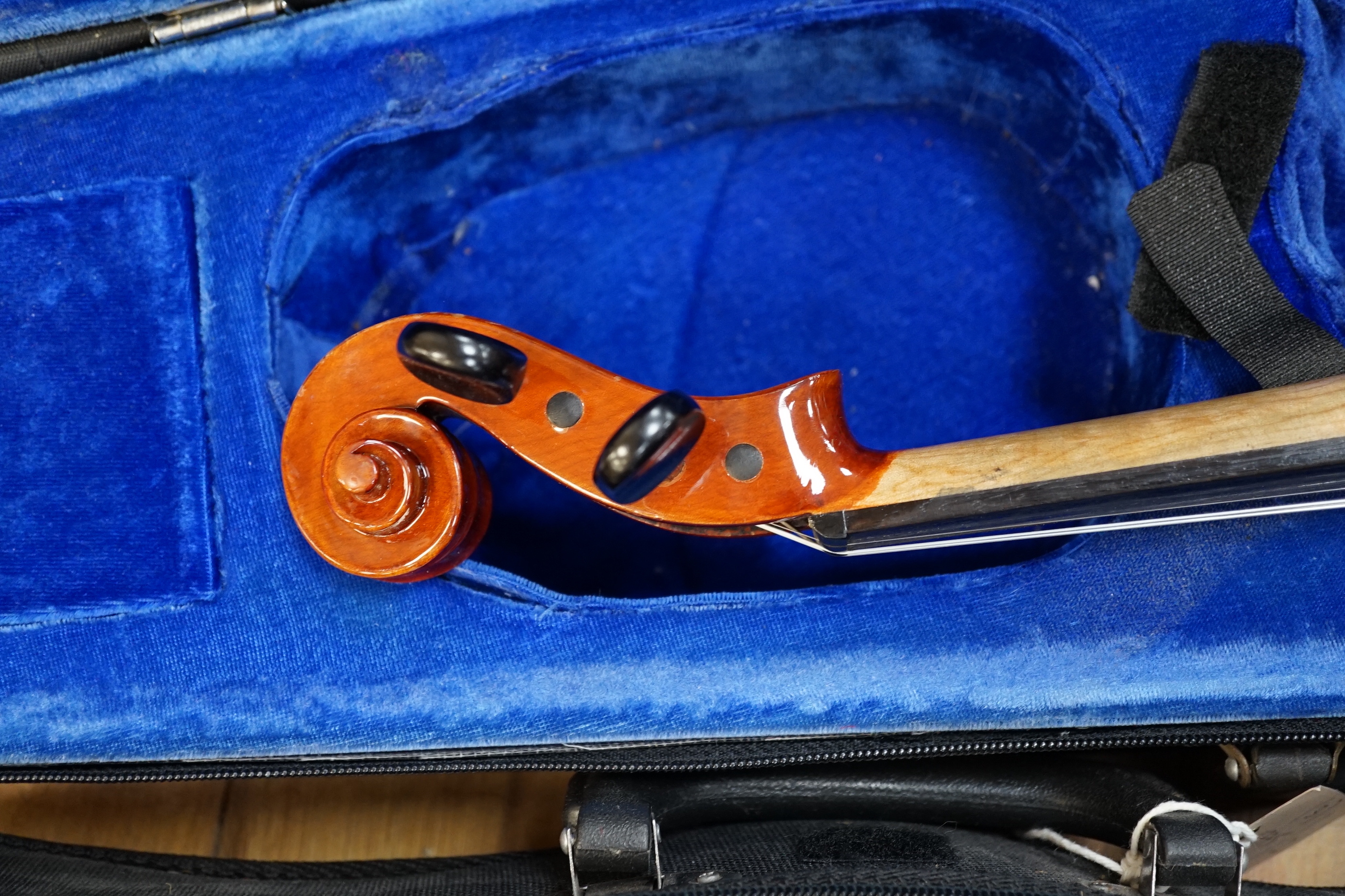 A 19th century English violin, bears hand written paper label, a modern Stentor violin and a metronome